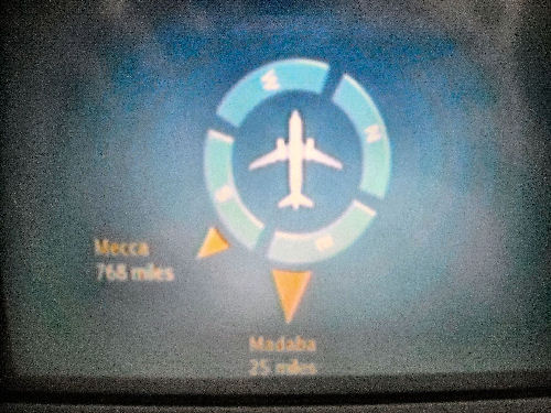 Mekka-Pfeil im Flugzeug